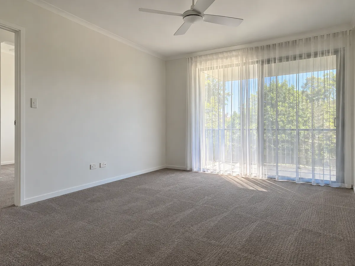 Empty living room with freshly vacuumed carpet